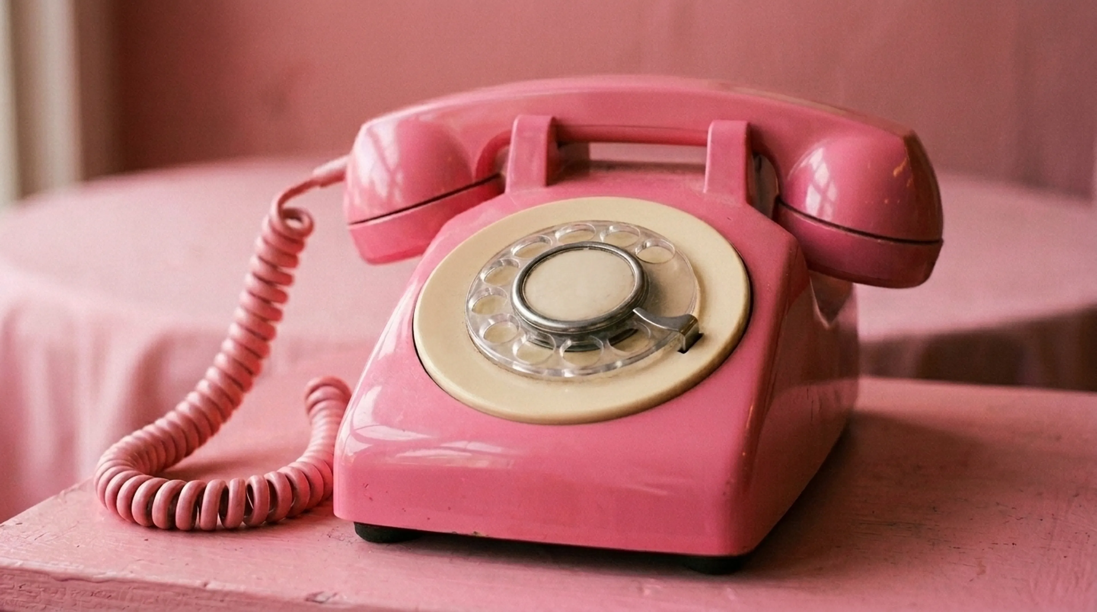 https://mr0.homeflow-assets.co.uk/files/branch_photo/image/7015/3871/_x_/Pink_dial_telephone_close_up_202606151315.jpg