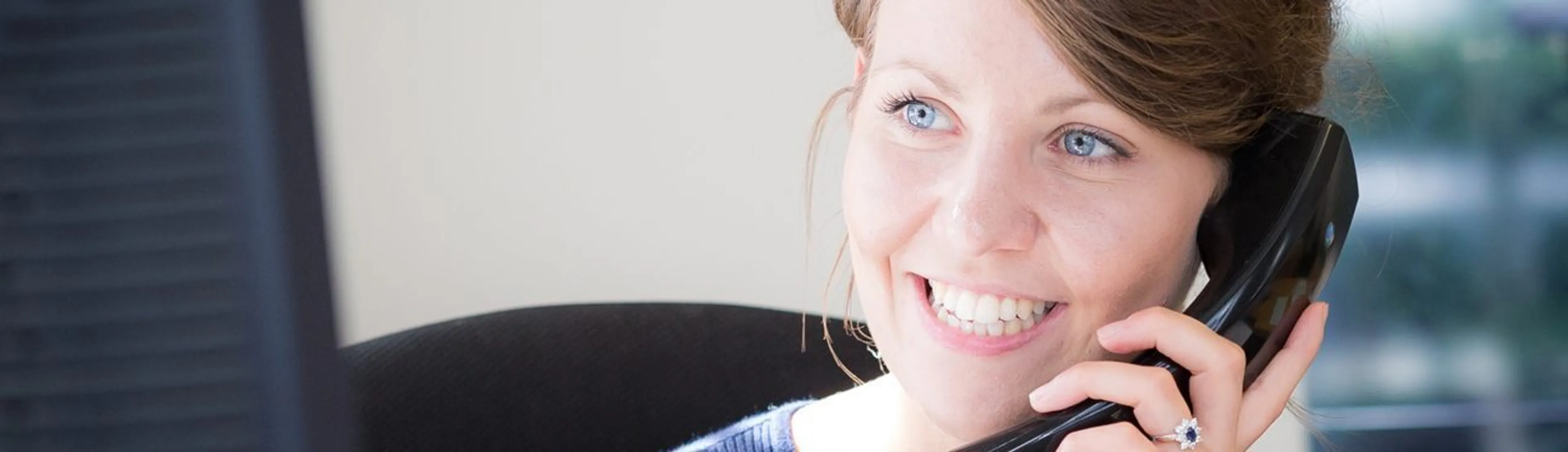 https://mr0.homeflow-assets.co.uk/files/site_asset/image/6793/3592/Woman-on-telephone_1296x374_acf_cropped.jpg